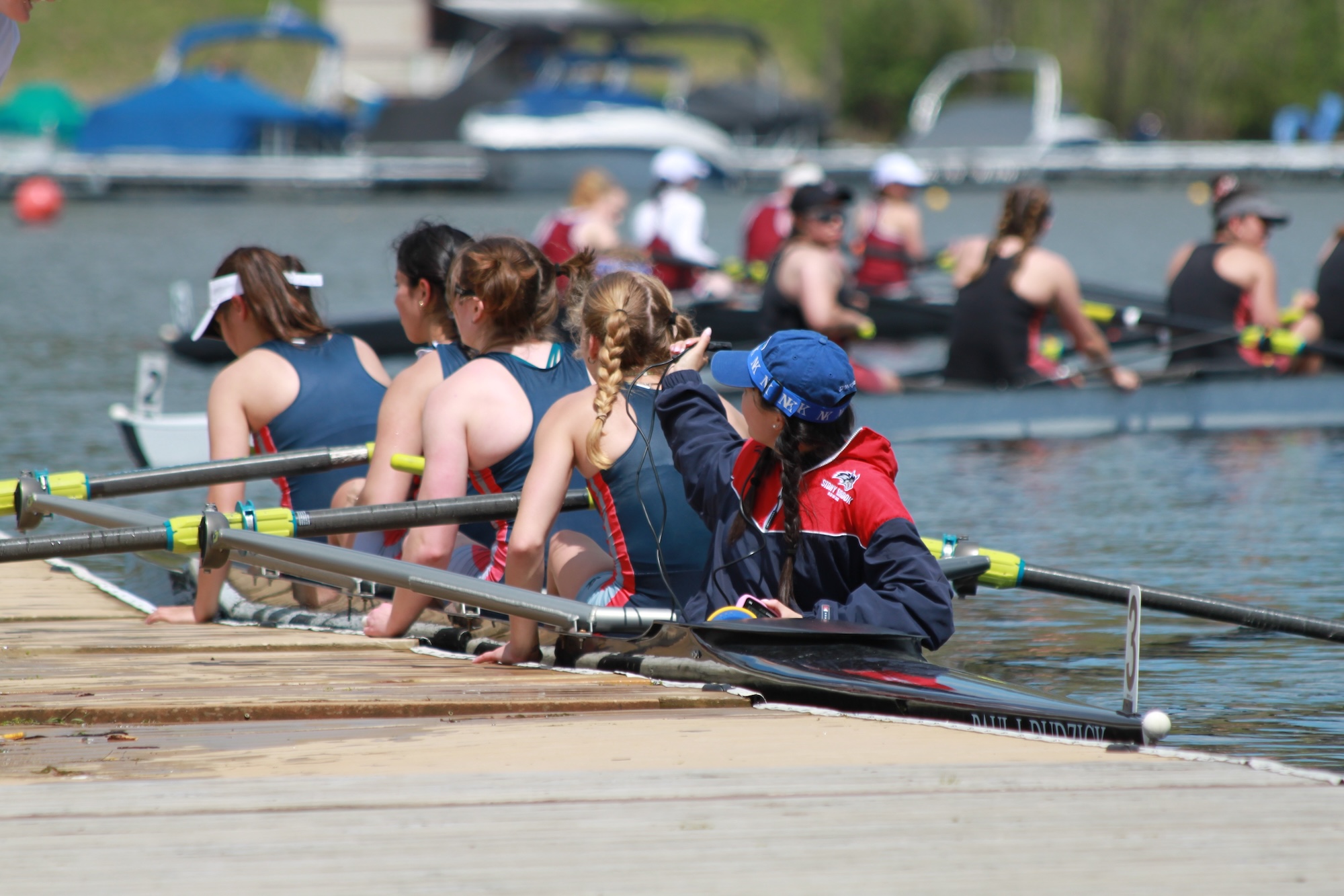 4 boats racing with eachother in practice in Lake Lure, North Carolina.